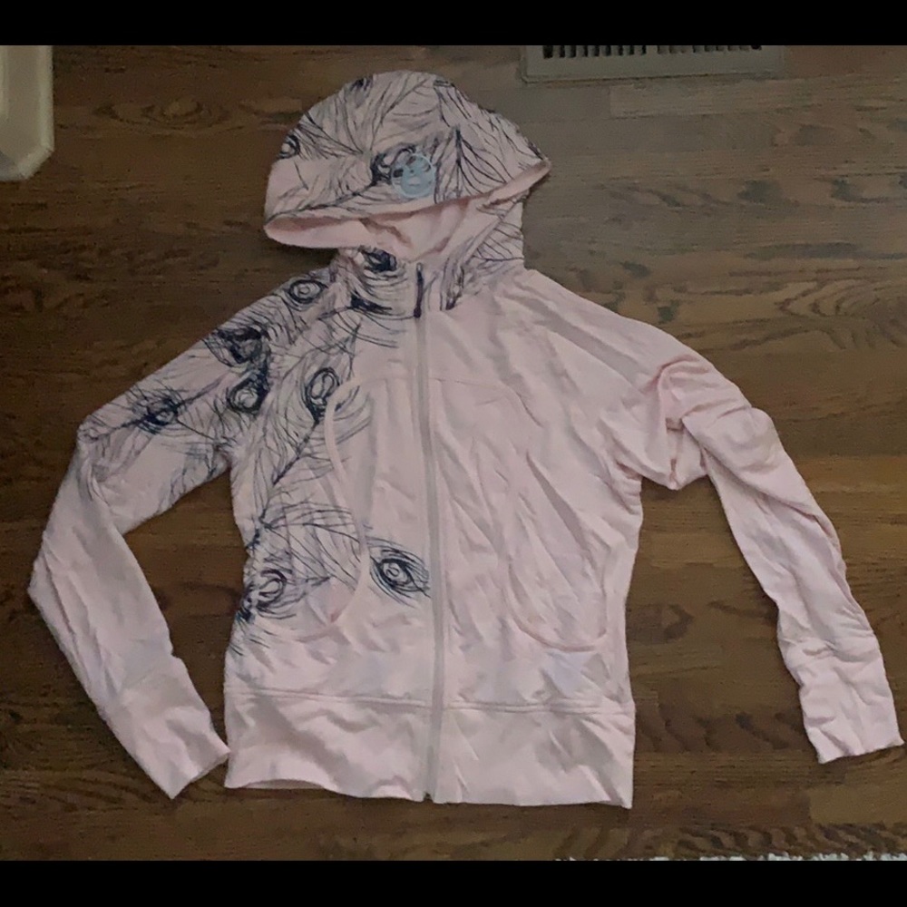 Lululemon zip up jacket with hood.